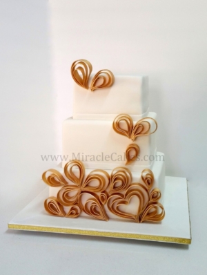 White and Gold modern wedding cake