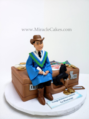 Graduation cake with a figurine topper