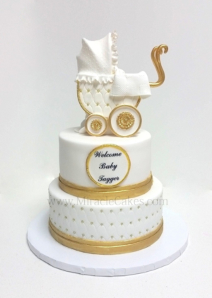 White and Gold themed baby shower cake with a 3D carriage topper