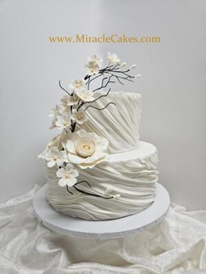 Modern anniversary cake with sugar flowers